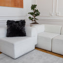 A decorative pillow made from ultra-soft black faux fur with a long, rich pile. Eye-catching and incredibly comfortable, it’s the ideal choice for glamour, modern, or minimalist interiors.